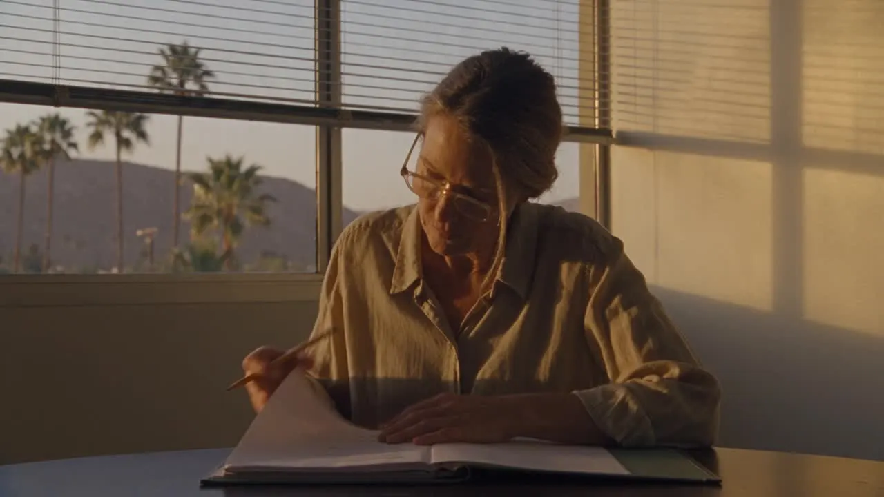 A strategist reviewing a printed plan in a sunlit San Fernando Valley office